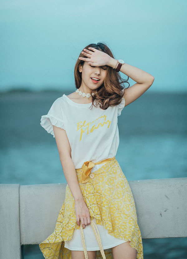 Asian girl with a yellow skirt